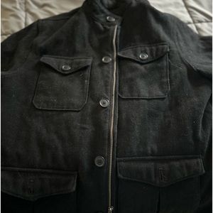 Large men’s Old Navy, black winter jacket lined with zippers, pockets& buttons.